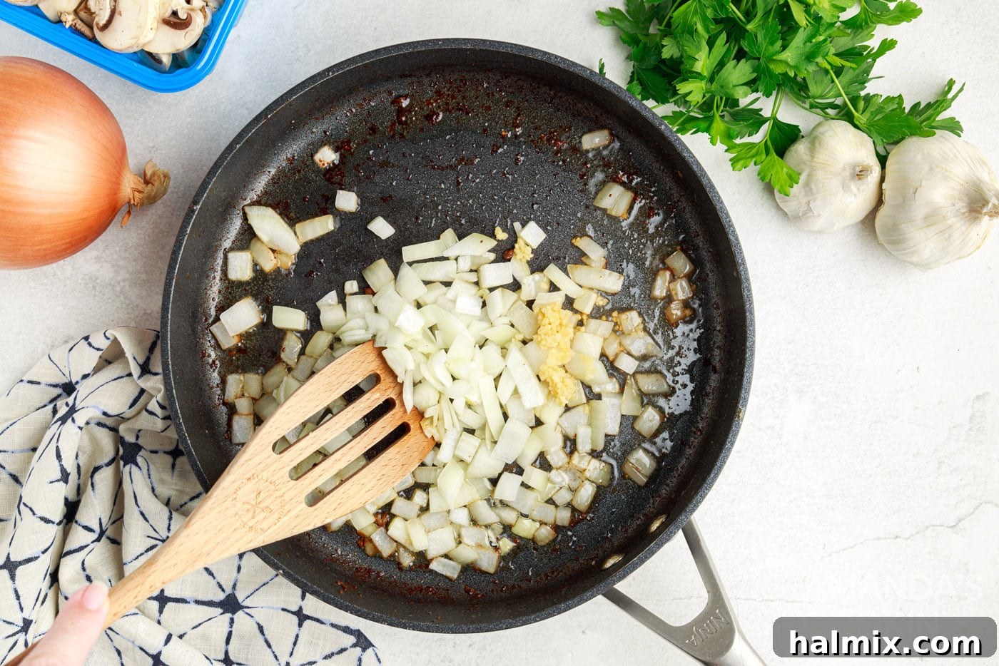 sauteeing onion and garlic in skillet