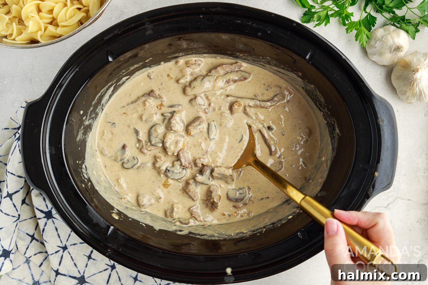 stirring crockpot beef stroganoff