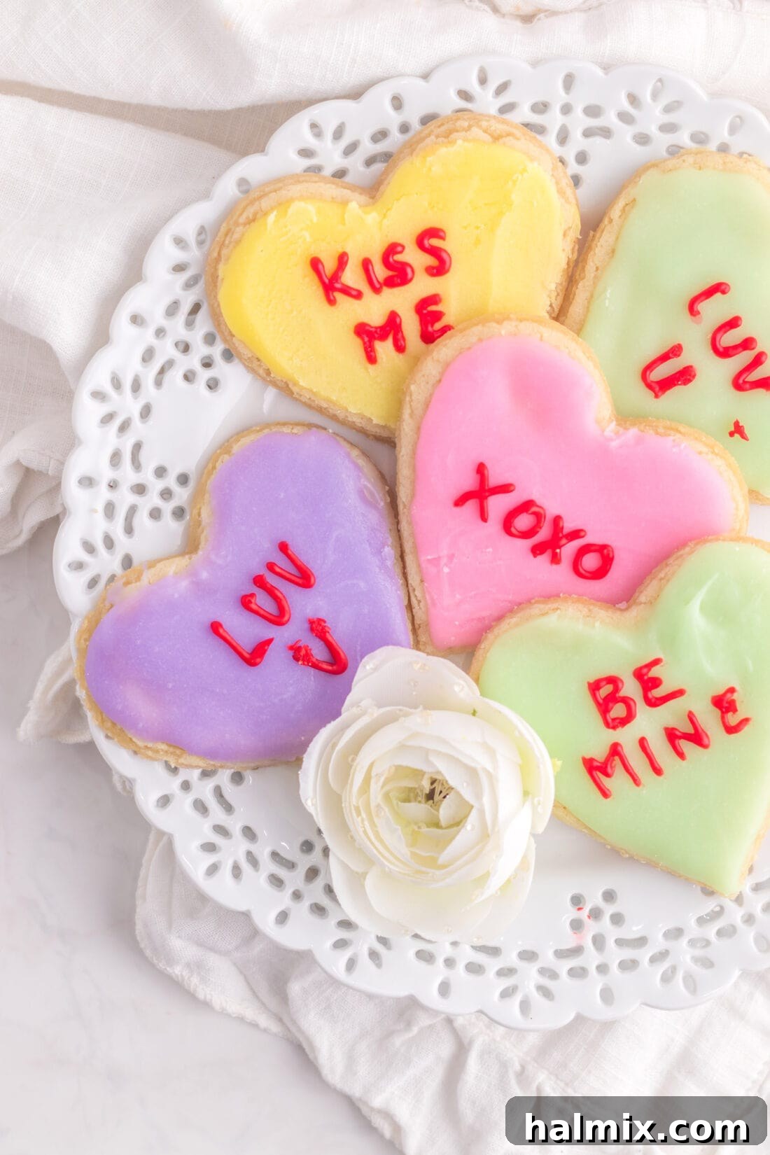 A festive plate filled with decorated Conversation Heart Cookies, perfect for sharing