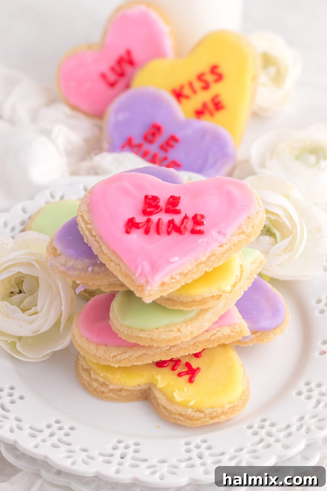 A stack of pastel-colored Conversation Heart Cookies, ready for gifting