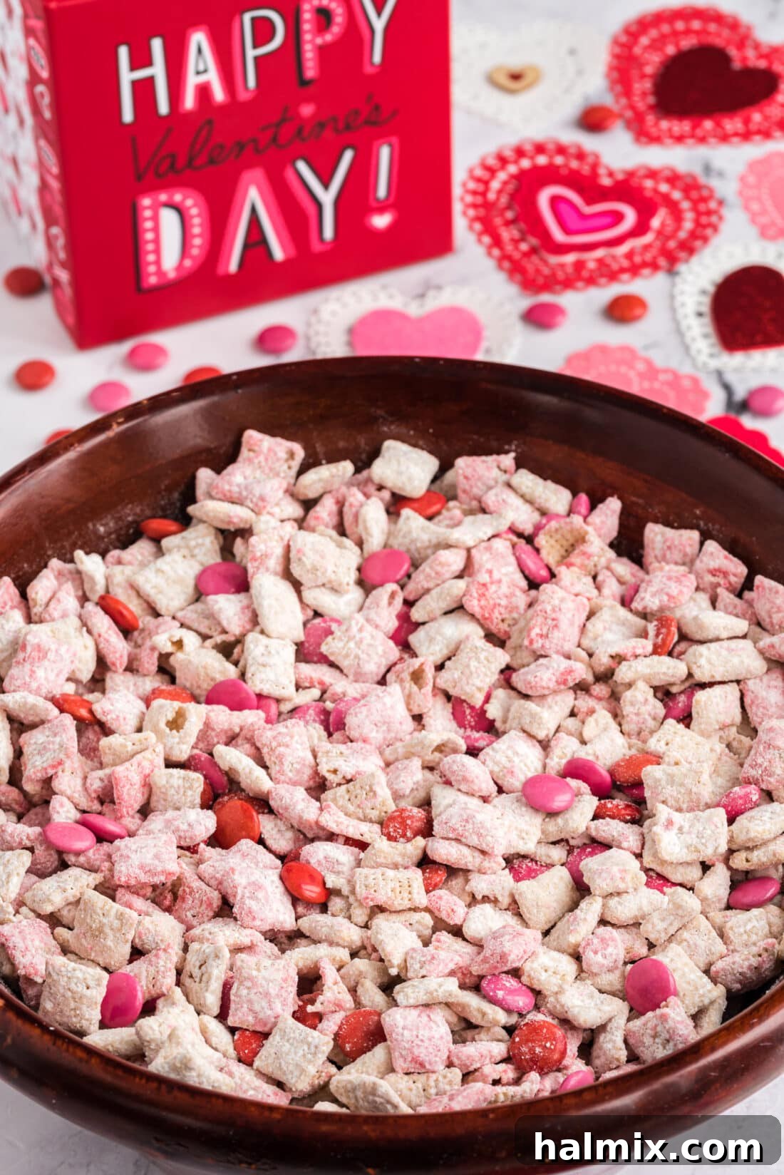 Valentine Muddy Buddies in a bowl, ready to be enjoyed
