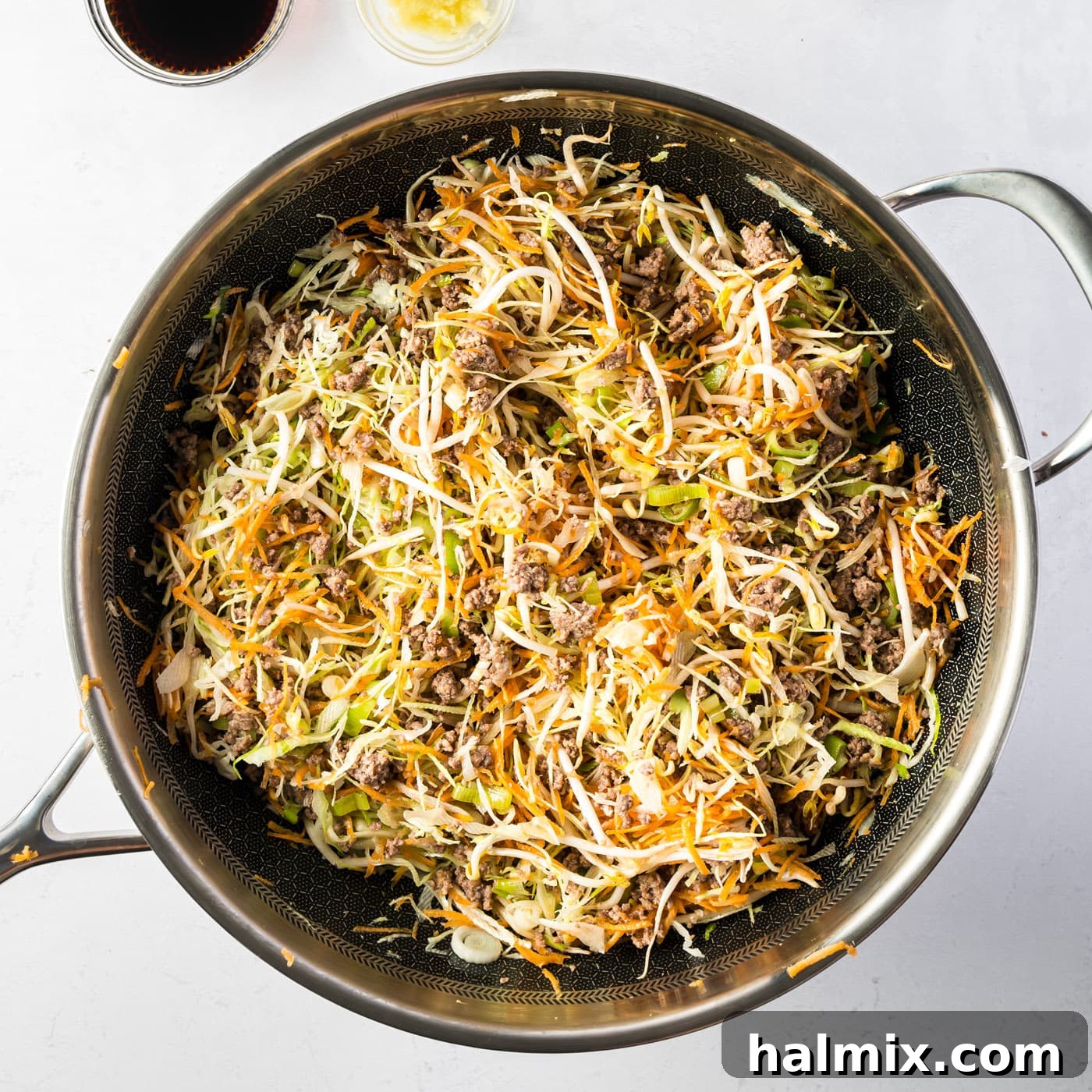 Egg roll in a bowl mixture cooking in a skillet