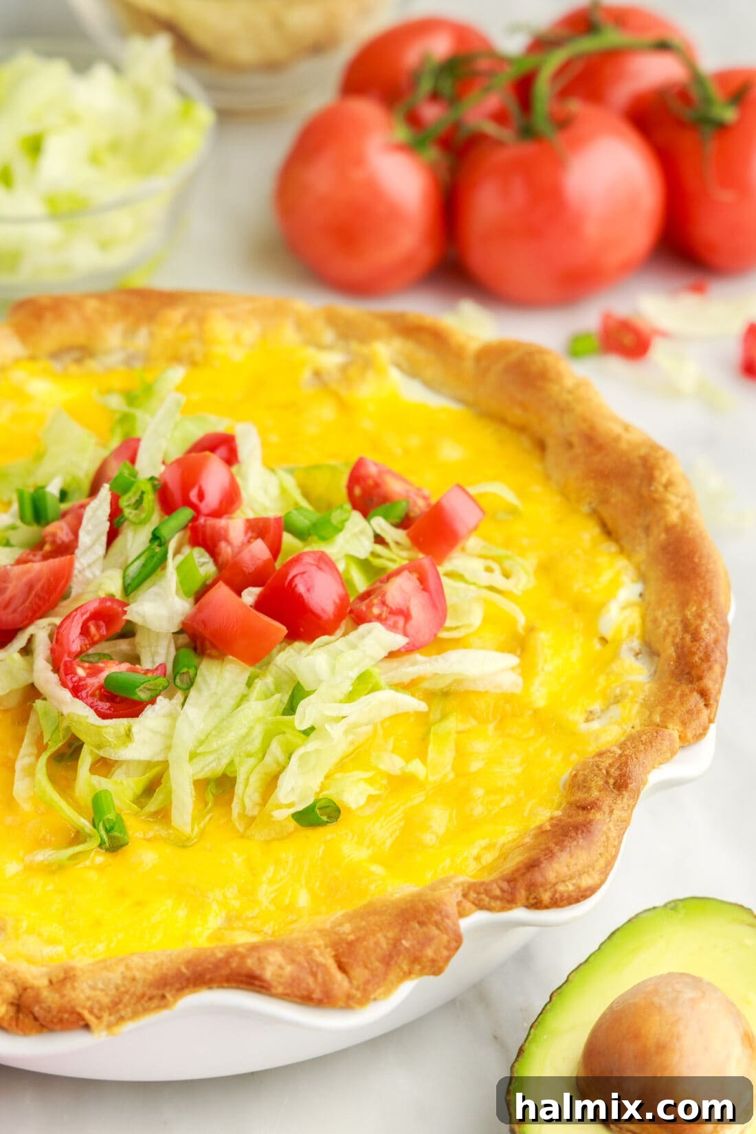 Ultimate Taco Casserole 14 A delicious slice of Taco Pie on a plate, showing off its beautiful layers and golden-brown crust.