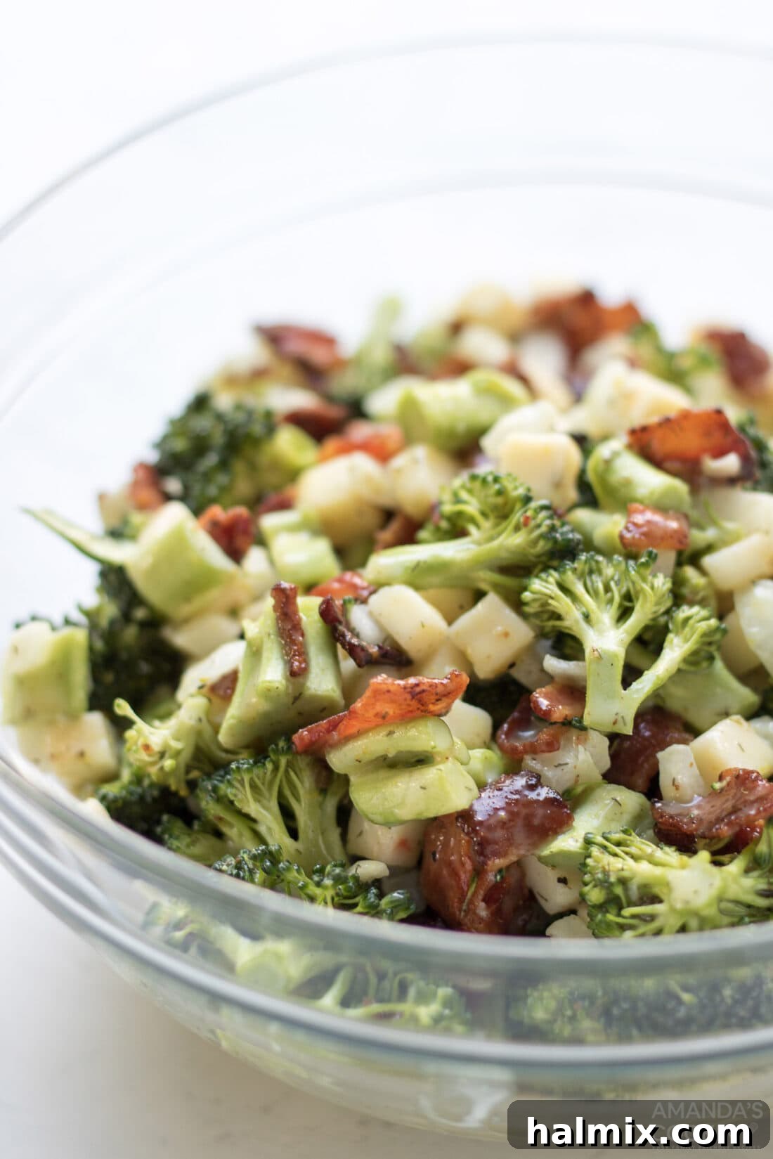 Creamy Broccoli Salad 3 Close-up shot of the fresh broccoli salad in a serving bowl, showcasing its rich textures and appealing colors before being served at a gathering.