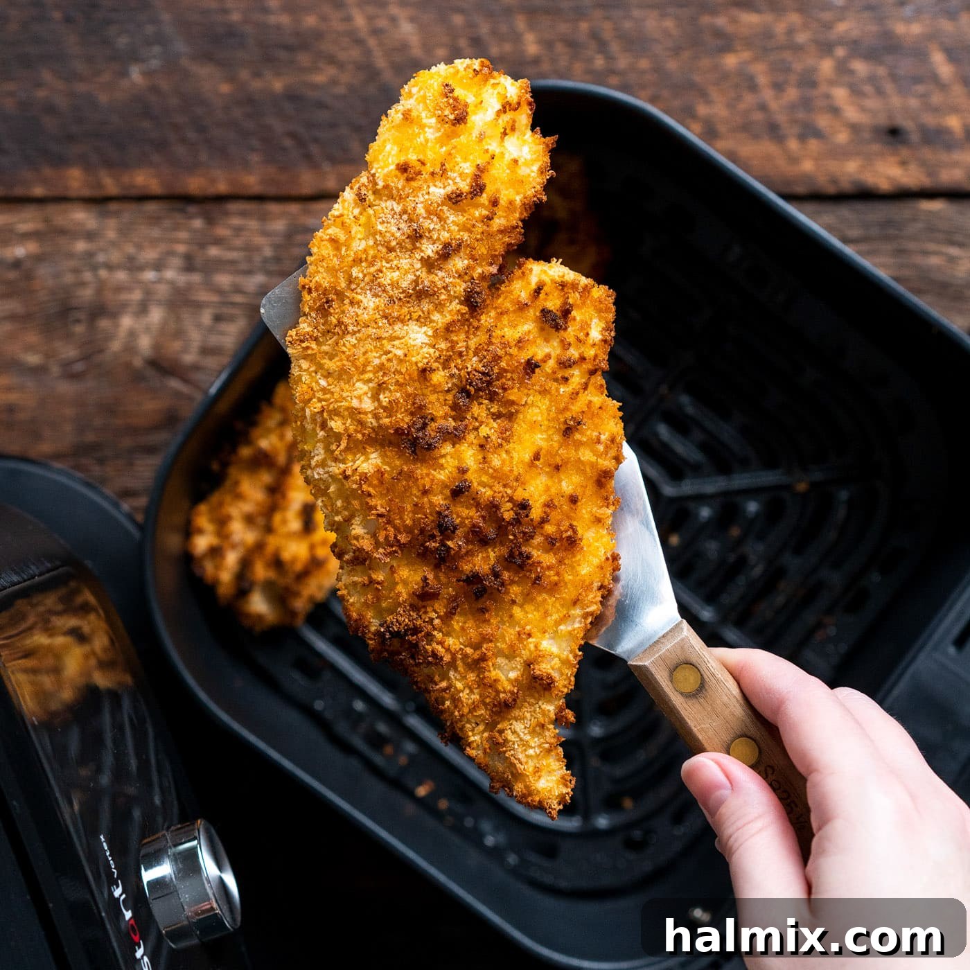 Perfectly cooked air fryer fish, golden and crispy, ready to serve