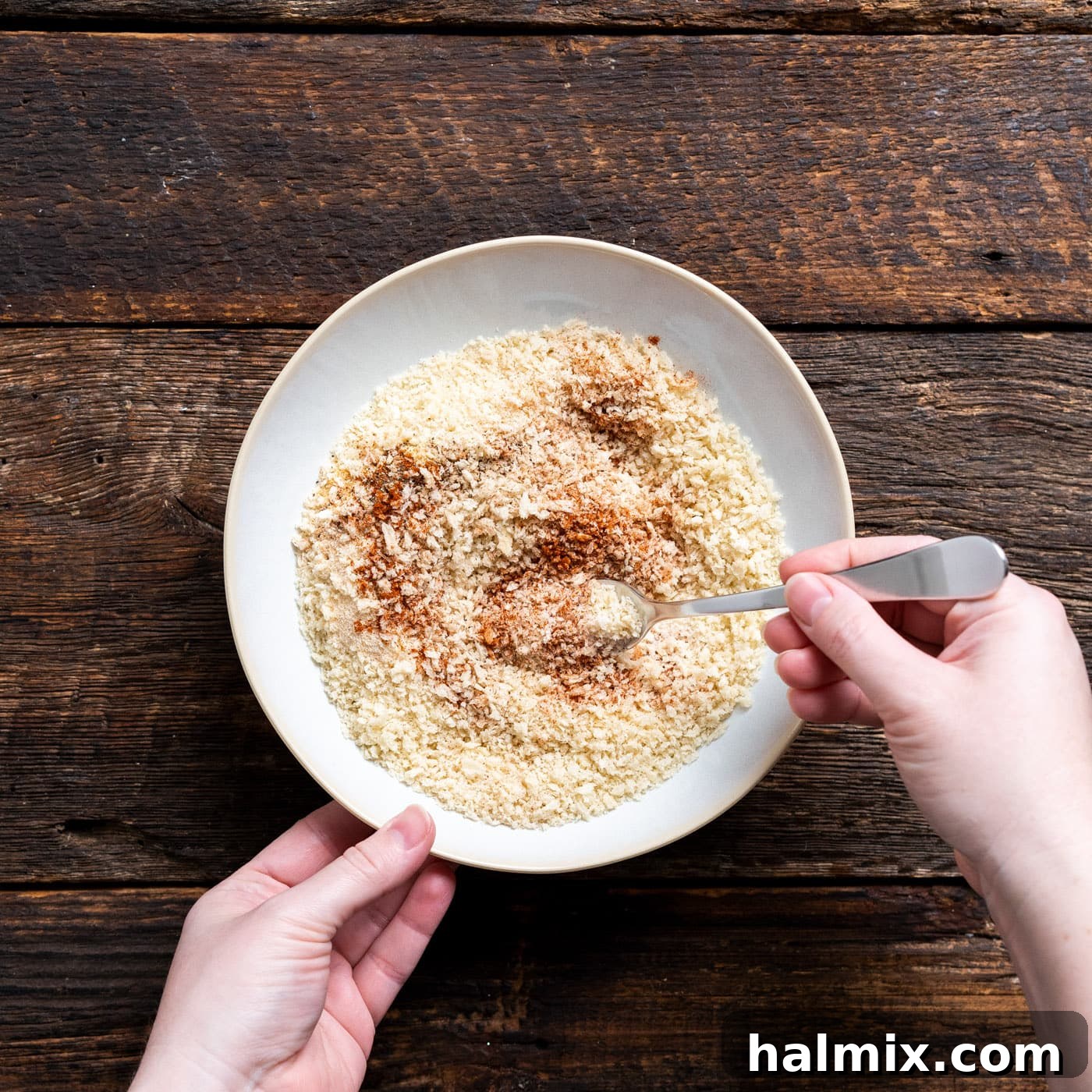 Seasonings mixed with panko breadcrumbs in a bowl, ready for dredging