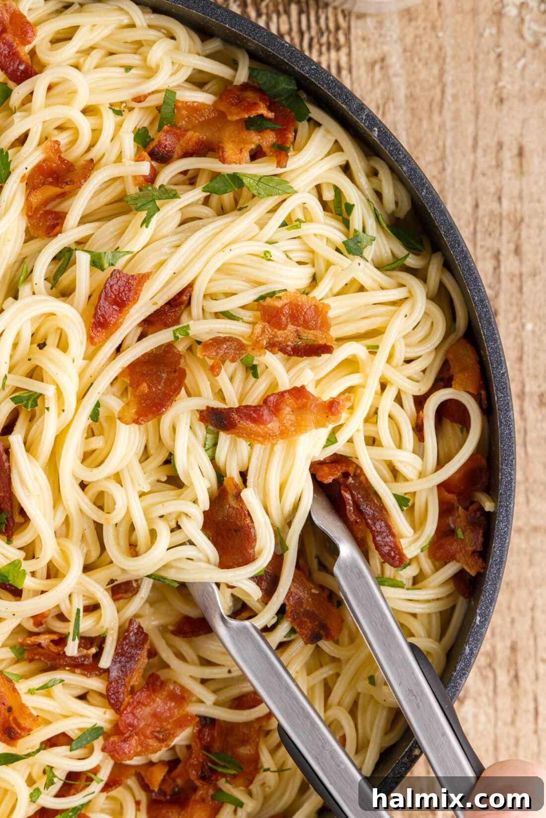 Pasta Carbonara with tongs