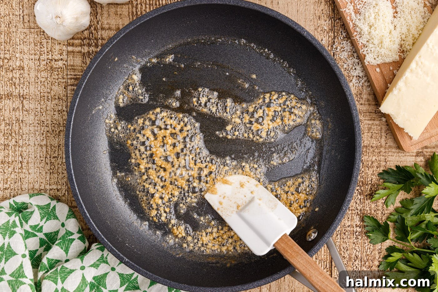 sauteeing minced garlic in a skillet