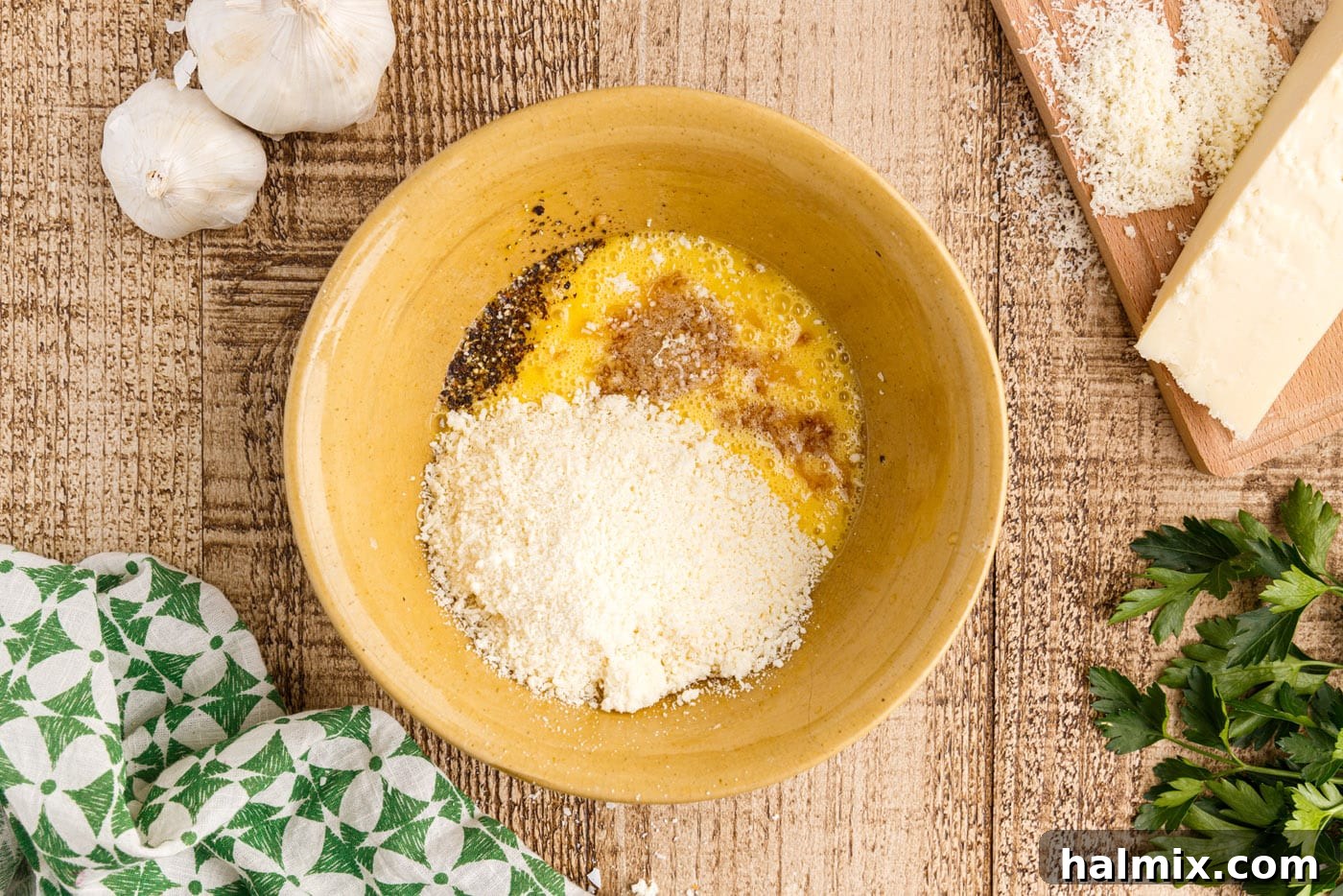 eggs, cheese, and seasonings in a bowl