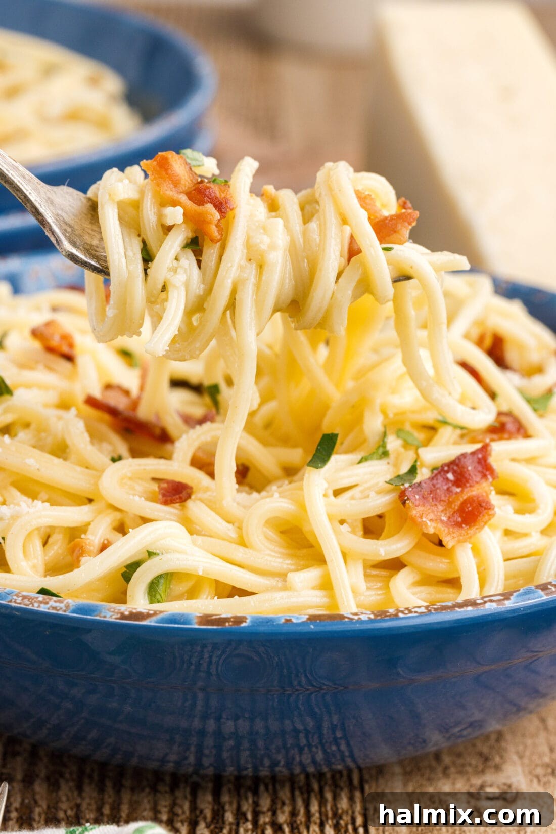 lifting Pasta Carbonara with a fork