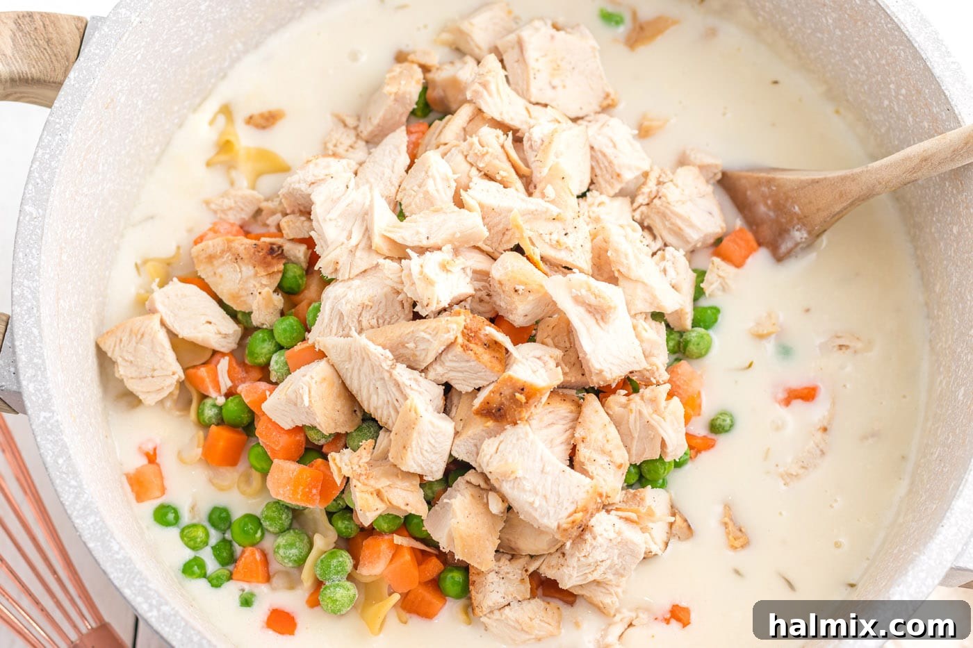 Creamy Chicken Noodle Delight 11 Chicken, peas, and carrots fully mixed into the egg noodle and creamy sauce mixture.