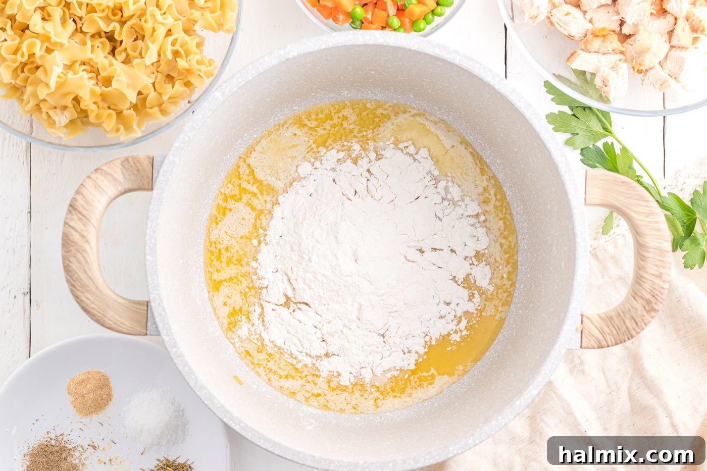 Creamy Chicken Noodle Delight 6 Butter and flour cooking in a pot, forming a golden roux.