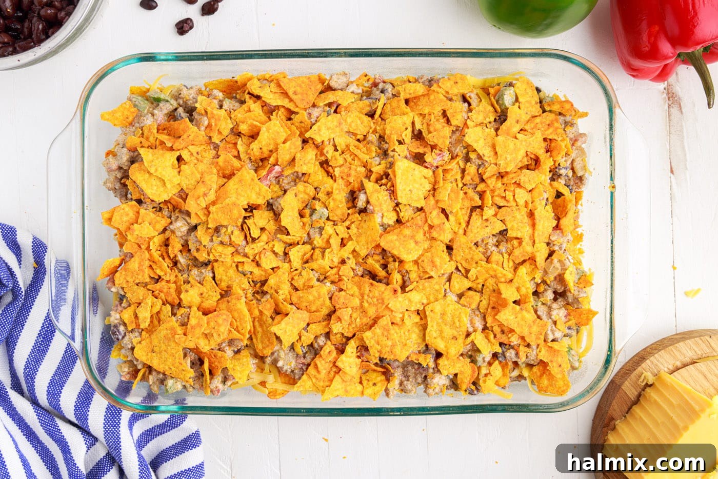 Final layer of crushed Doritos placed over the ground beef.
