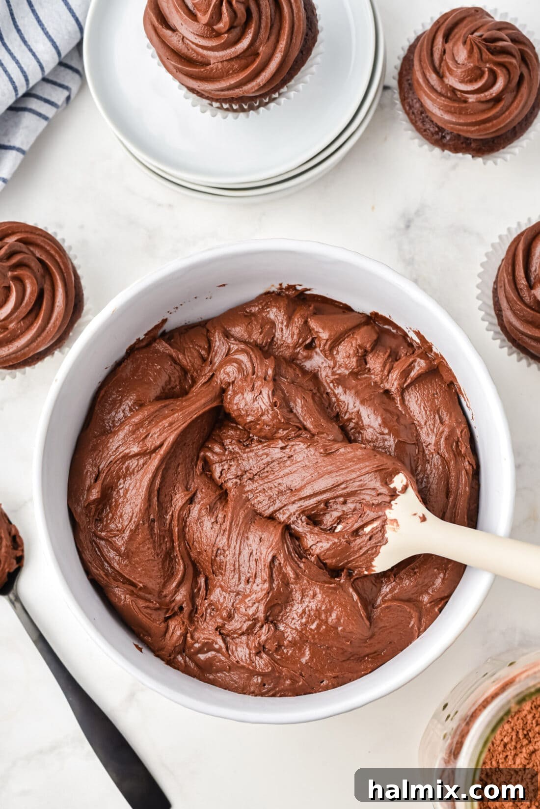Chocolate Fudge Frosting in a bowl, a rich and smooth dessert topping