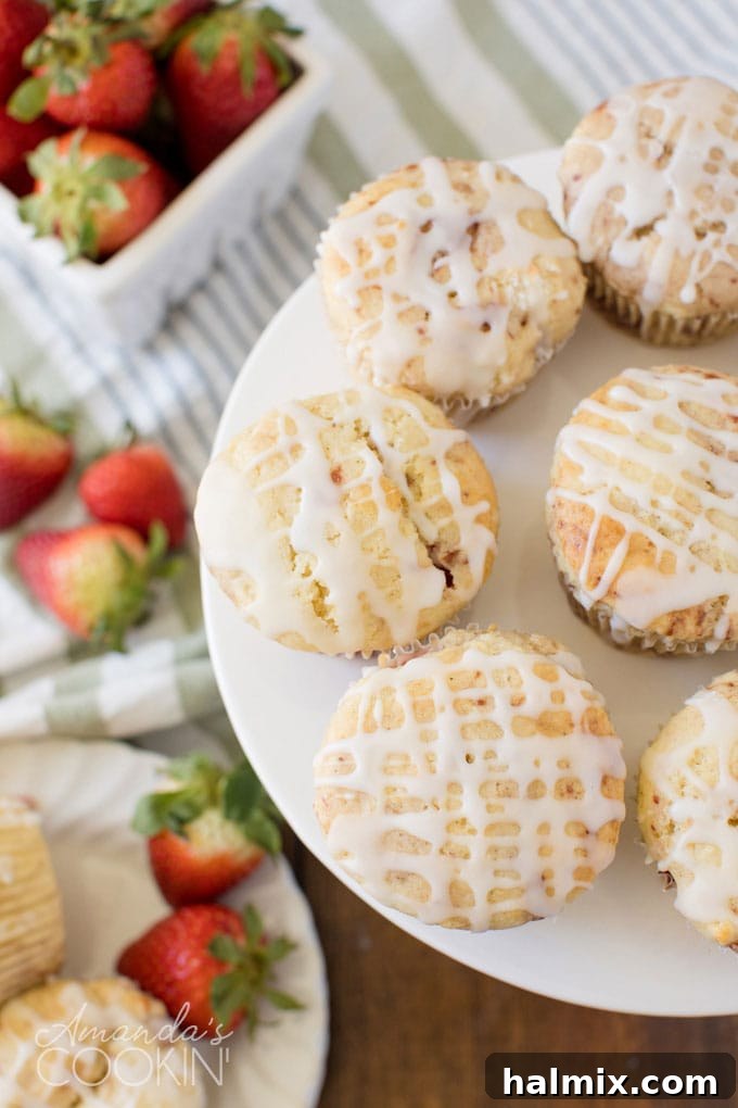 plate full of glazed strawberry muffins