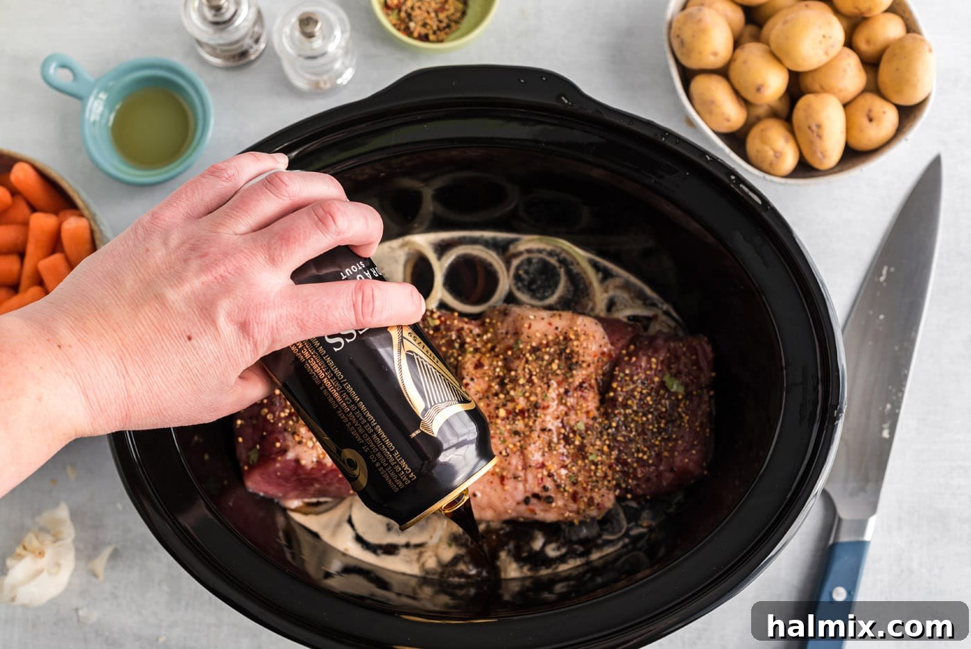 [ouring beer over crockpot corned beef