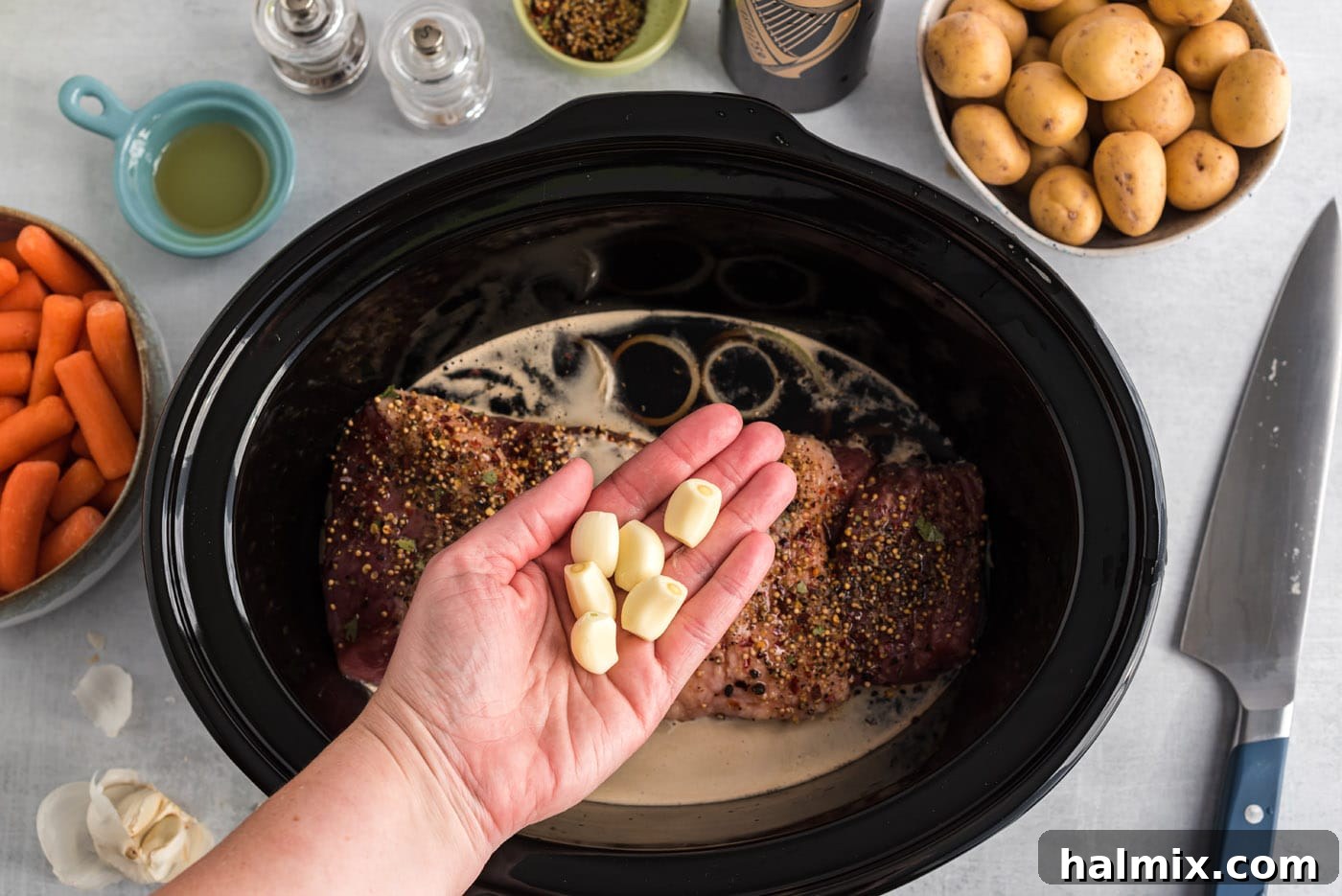 garlic cloves over crockpot corned beef