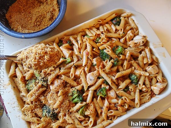 Close-up of Baked Penne with Chicken, Broccoli & Smoked Gouda in a baking dish