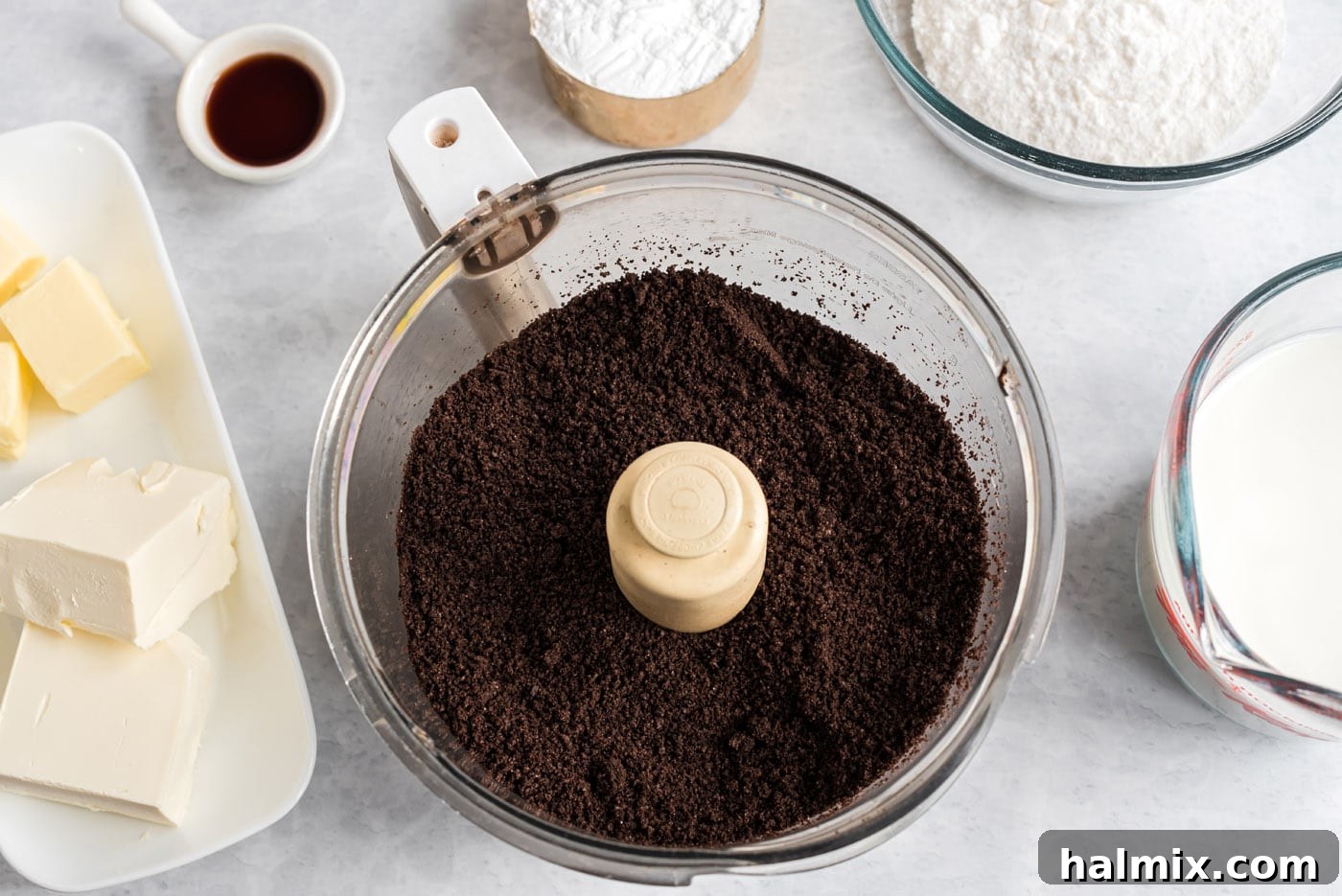 Crushing Oreos for the Dirt Cake Base Oreos being crushed in a food processor