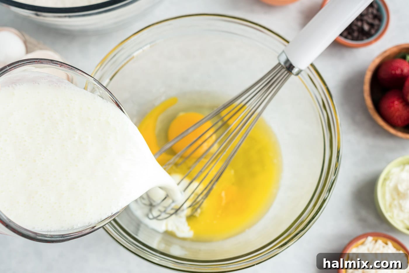 Whisking buttermilk with eggs and butter