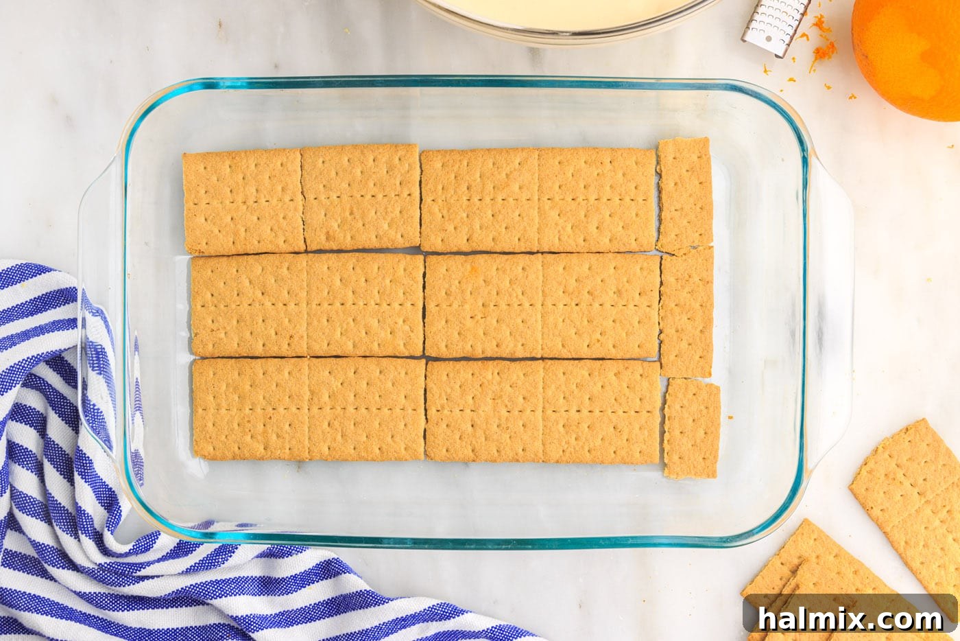 A single layer of graham crackers covering the bottom of a 9x13 baking dish