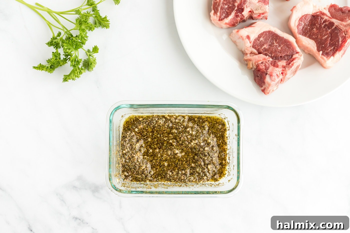 Preparing the savory wet rub for lamb chops, showing the ingredients mixed into a paste.