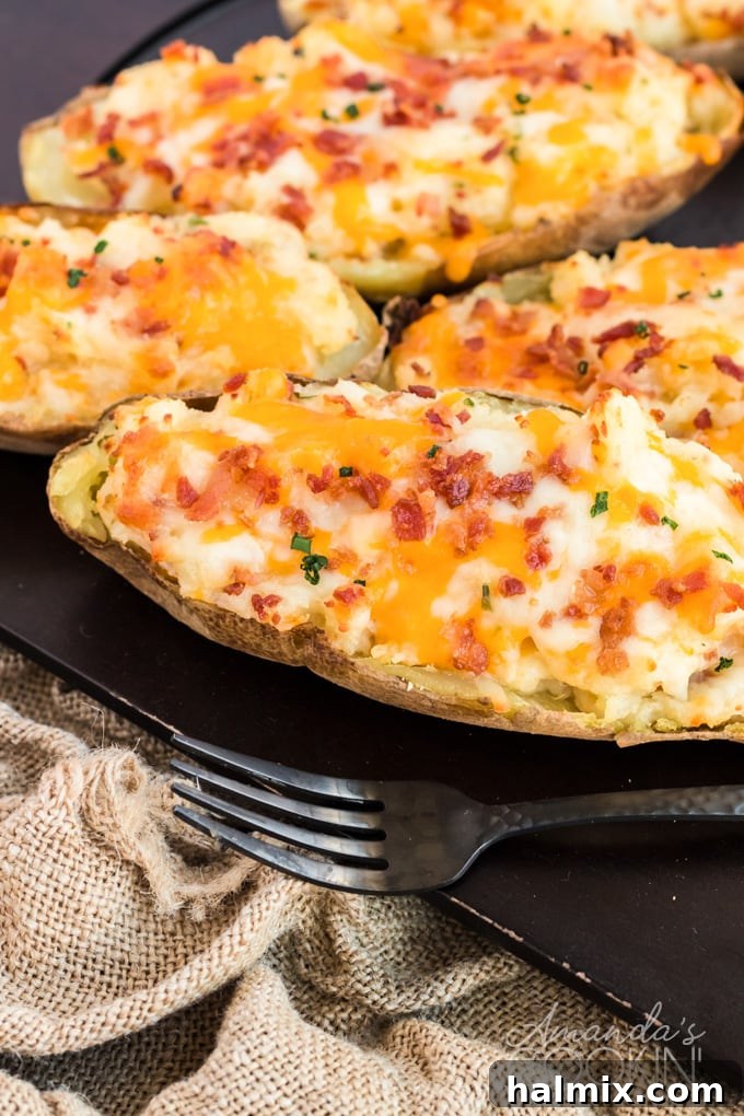 twice baked potatoes on a black board