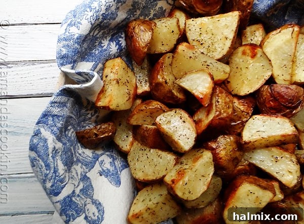 A detailed close-up of beautifully cut and roasted potato wedges, perfectly browned and tender, ready to be enjoyed as a comforting side.