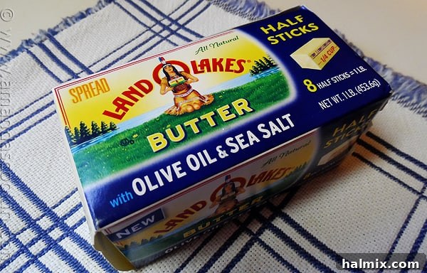 A high-quality photo of a Land O'Lakes Butter with Olive Oil & Sea Salt package, highlighting its rich texture and quality ingredients.