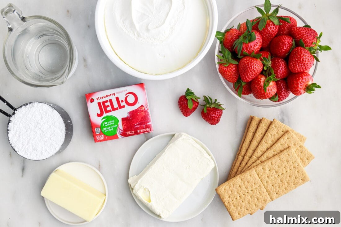Strawberry Lasagna Delight 4 A flat lay of all the fresh and packaged ingredients needed for making Strawberry Lasagna Trifle, including graham crackers, strawberries, cream cheese, and Cool Whip.