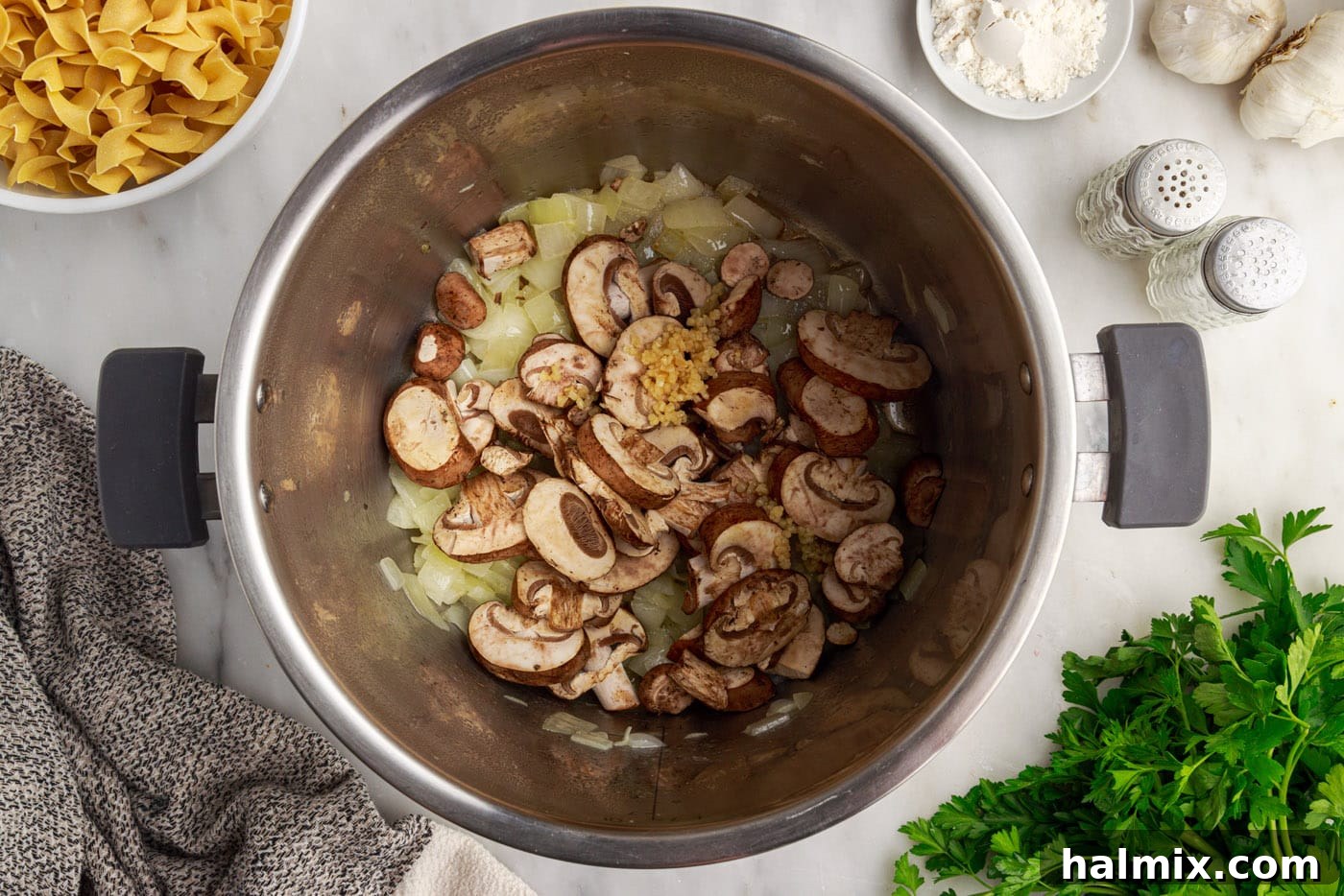Melted butter, sautéed onions, mushrooms, and minced garlic simmering in the Instant Pot.