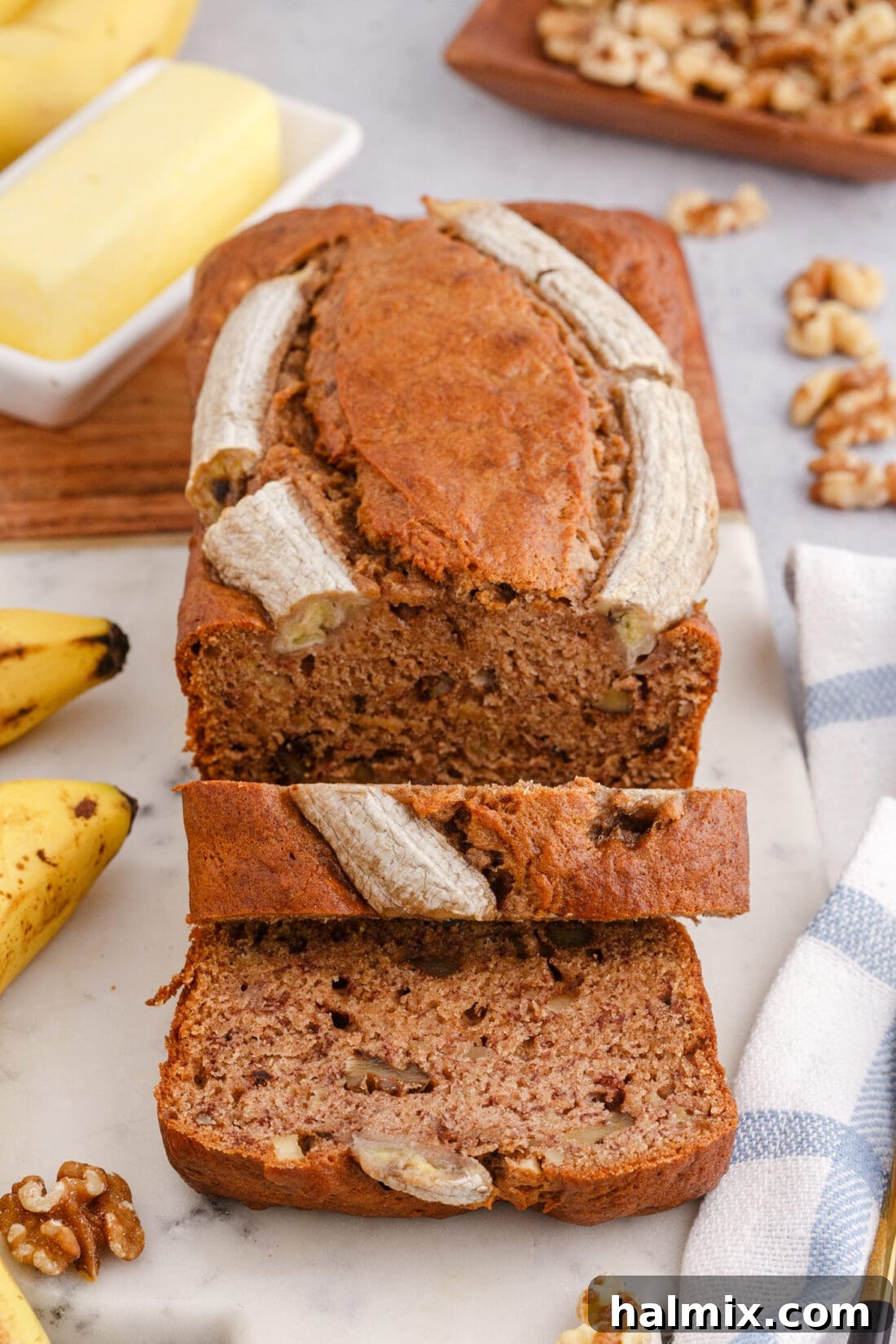 sliced Banana Nut Bread on a cutting board, ready to be served