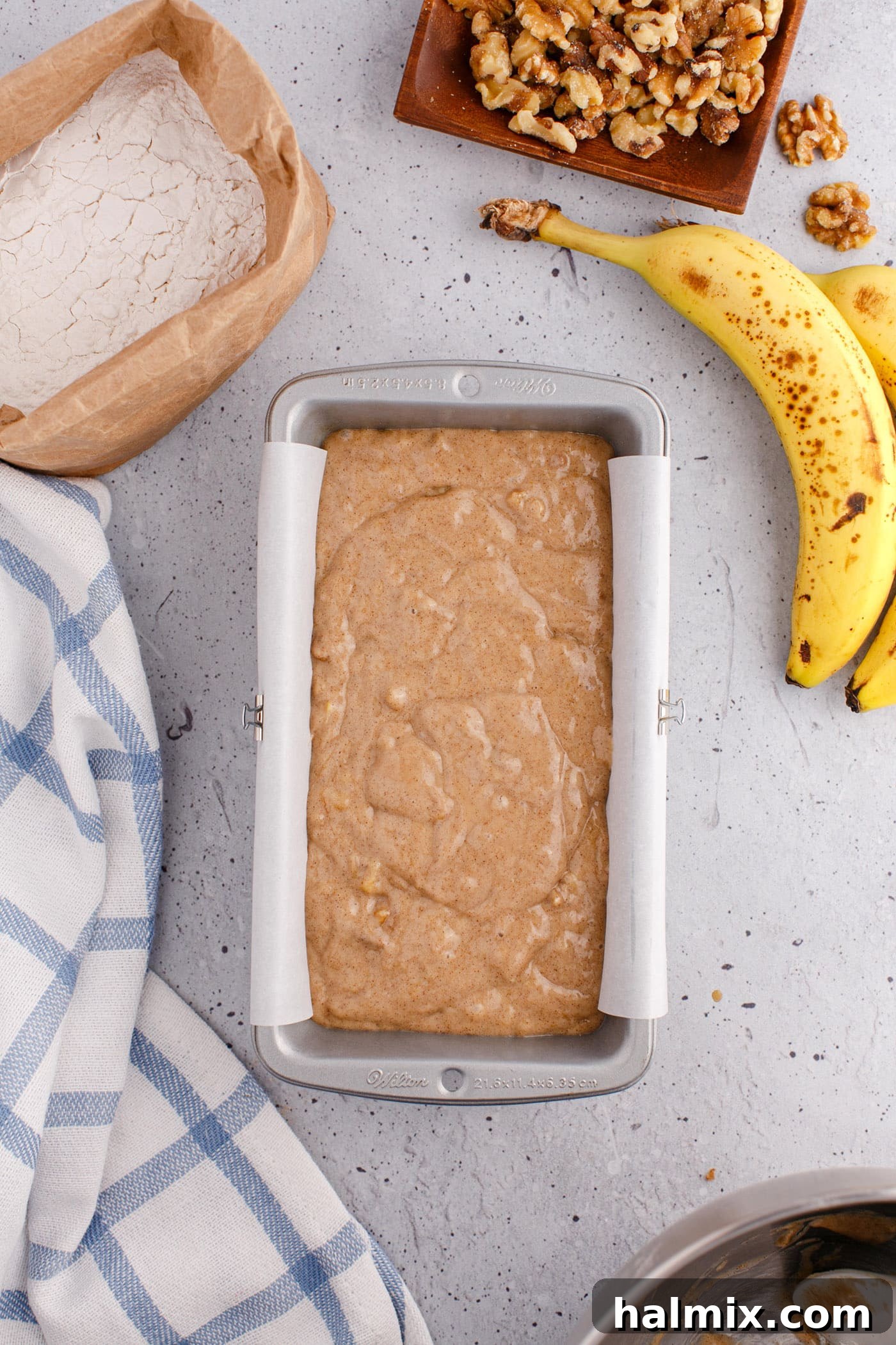 banana bread batter in a loaf pan, ready for baking