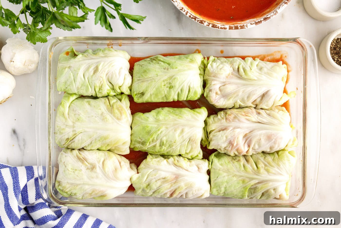 Savory Stuffed Cabbage Bundles 11 All the rolled cabbage rolls neatly arranged in the baking dish, before adding more sauce.