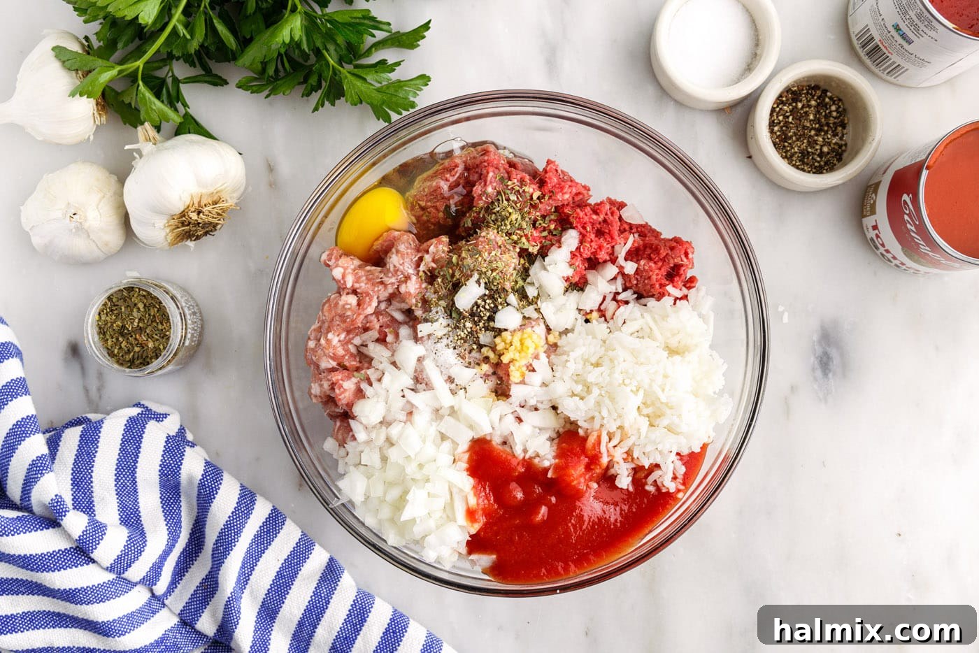 Savory Stuffed Cabbage Bundles 6 Ground beef and Italian sausage mixture in a bowl, seasoned with rice, onion, garlic, and egg, ready for stuffing.
