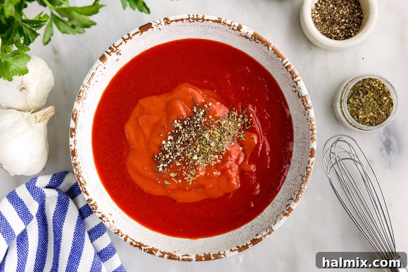 Savory Stuffed Cabbage Bundles 7 A bowl of tomato sauce and condensed tomato soup, whisked together for the cabbage rolls.