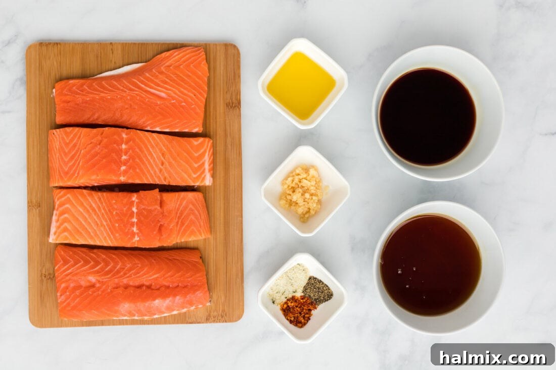 Maple Soy Glazed Salmon 4 All ingredients for Maple Soy Salmon laid out on a wooden cutting board.