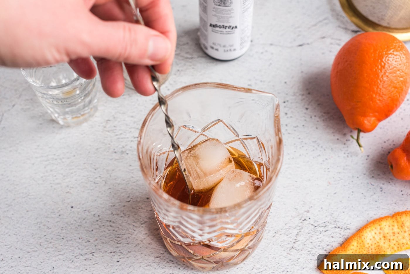 stirring manhattan cocktail with ice
