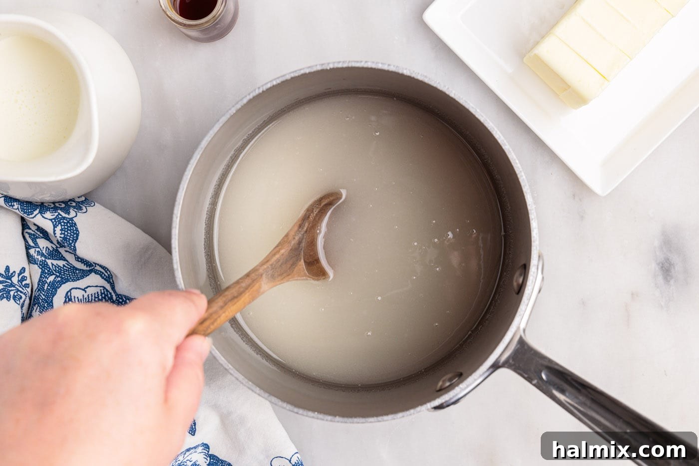 stirring corn syrup, sugar, and water in a saucepan