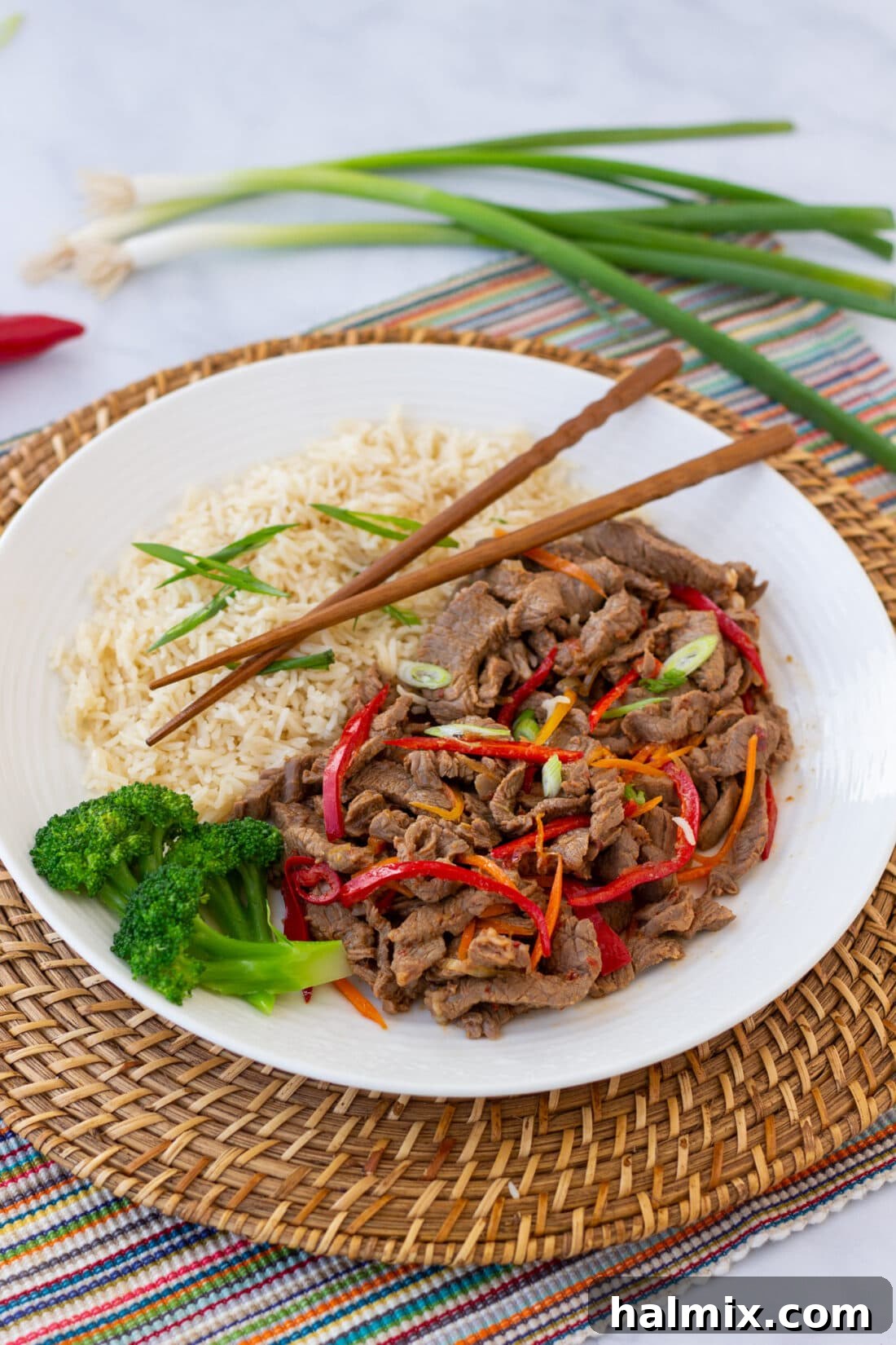 plate of Szechuan Beef with chopsticks