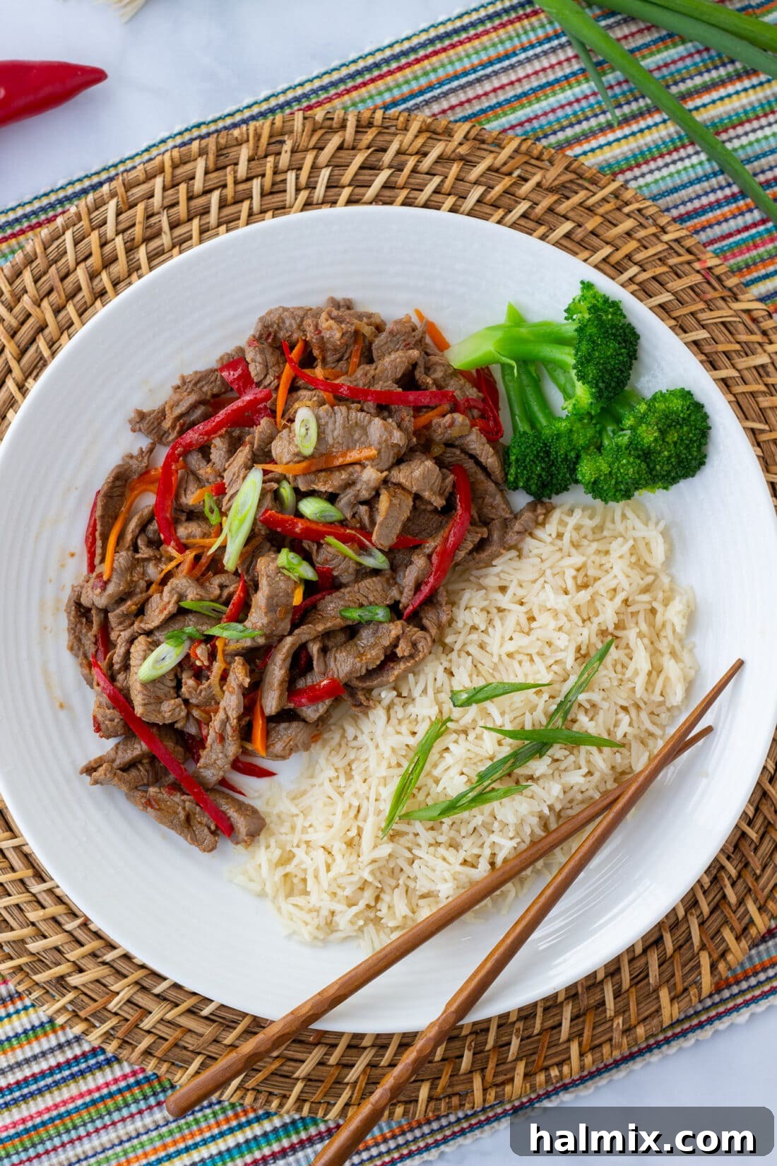 overhead view of Szechuan Beef on plate with rice