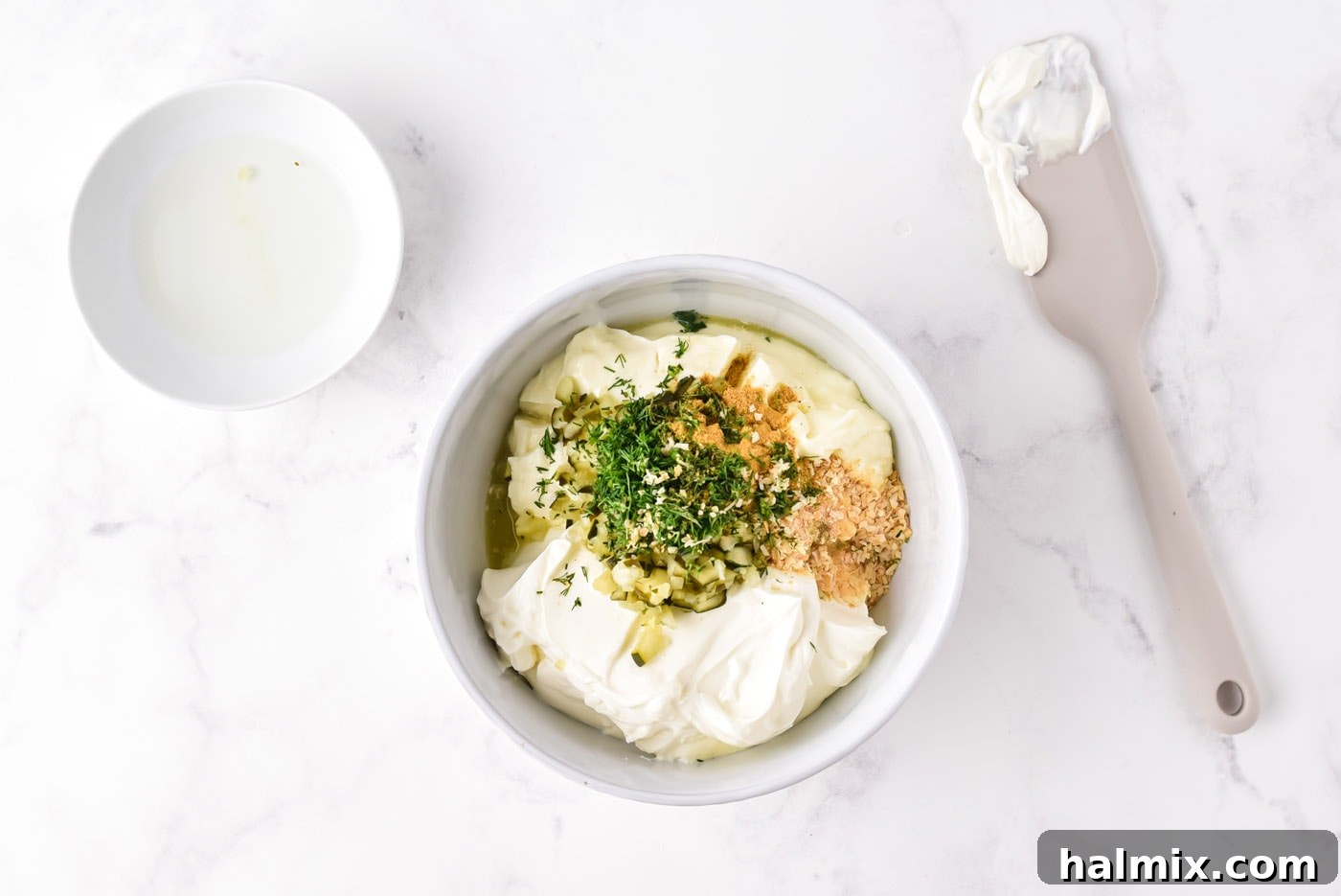 All dill pickle dip ingredients in a bowl before mixing