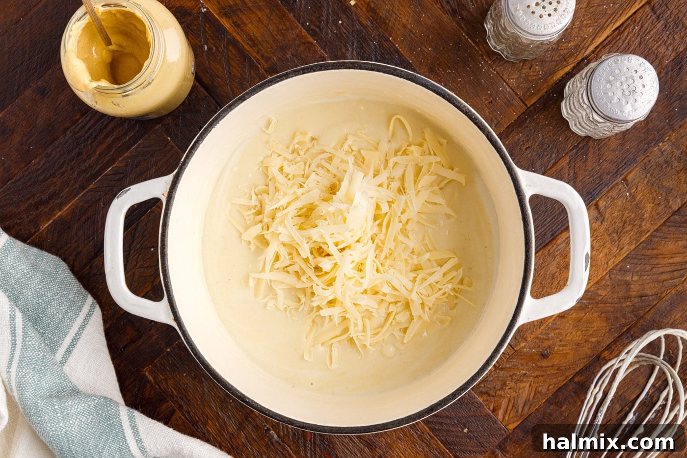 shredded swiss cheese in dijon cream sauce