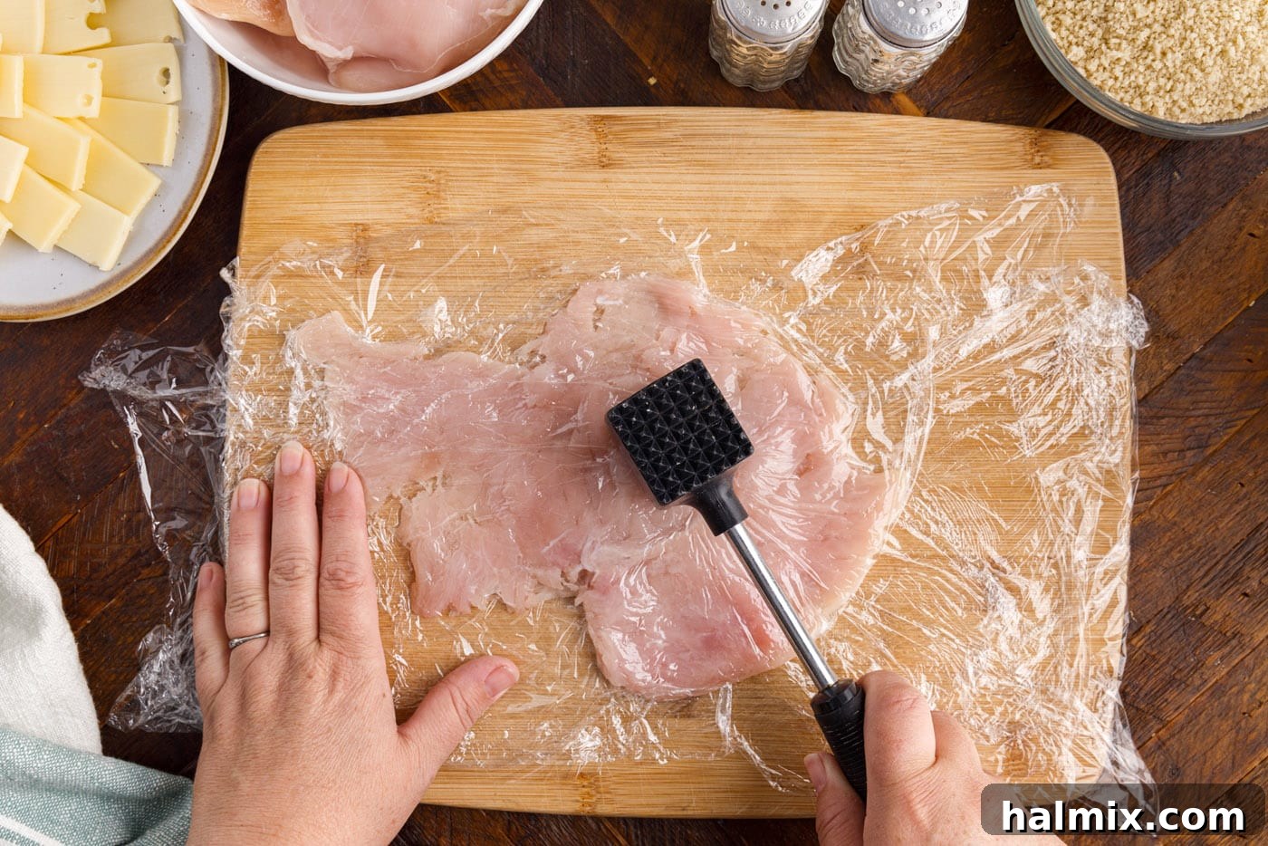 pouding chicken breast with meat tenderizer