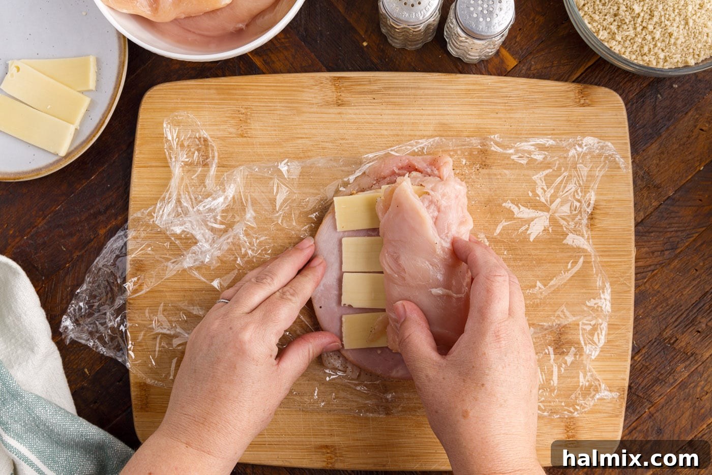 rolling chicken breast with ham and cheese