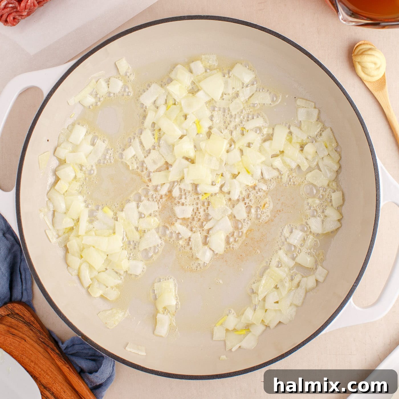 Creamy Ground Beef Stroganoff 5 Sautéing finely chopped onions in melted butter in a large skillet until translucent.