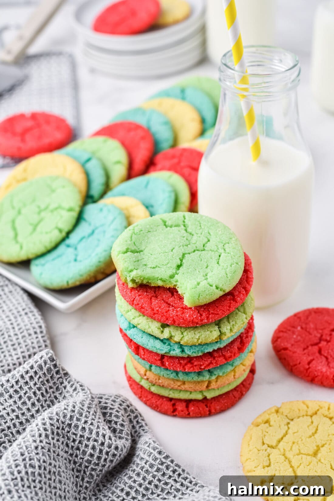 stack of Jello Cookies with a plate of cookies in back, ready to be enjoyed
