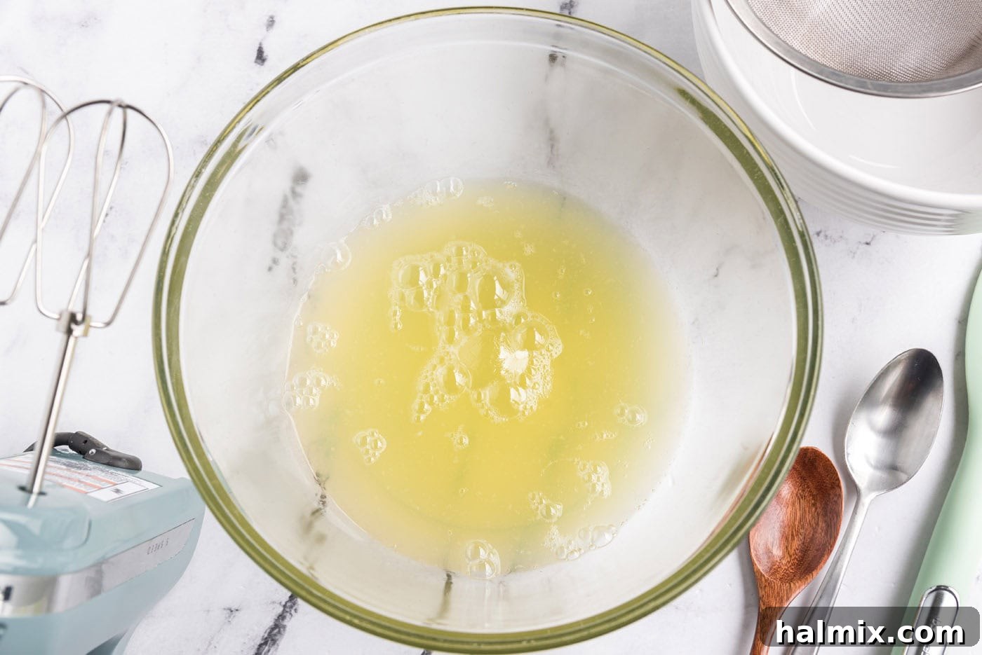 Feather-Light Angel Food Cake 5 Egg whites in a mixing bowl, ready to be whipped for angel food cake