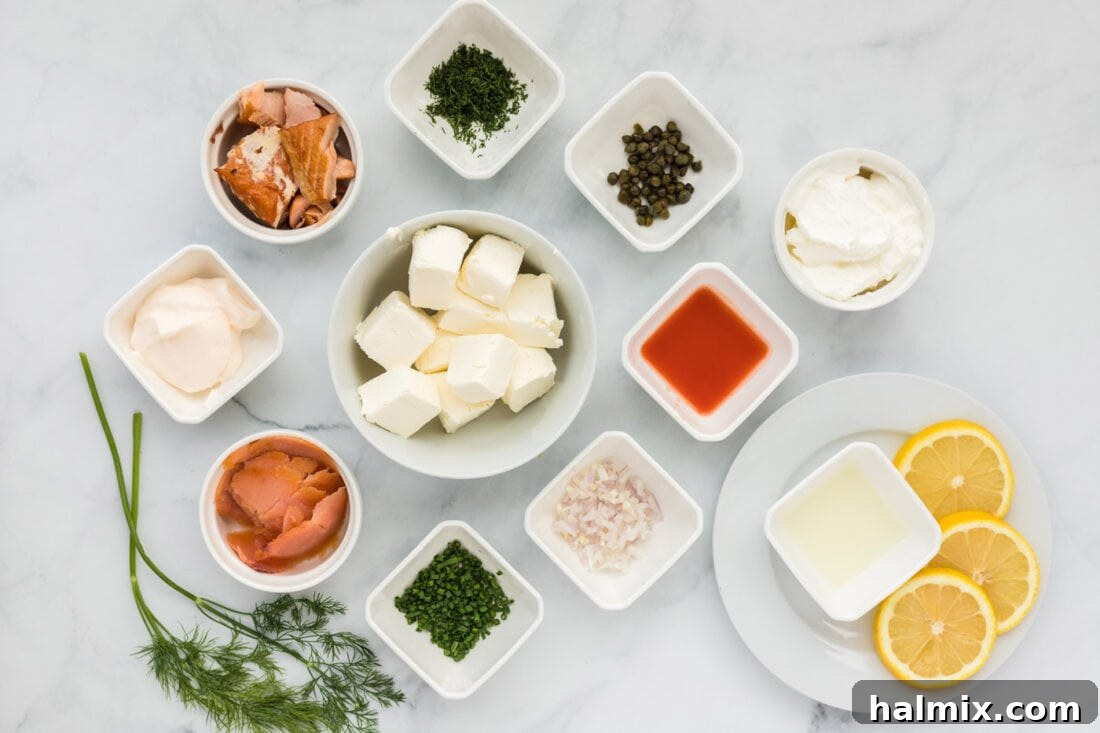 A vibrant selection of ingredients for Smoked Salmon Dip laid out on a kitchen counter.