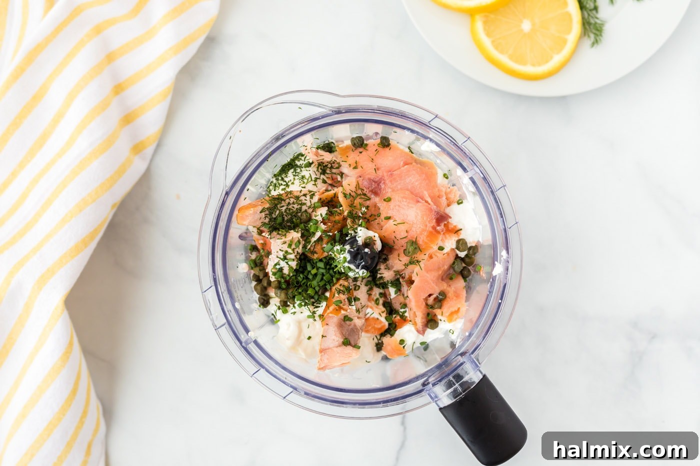 All ingredients for Smoked Salmon Dip in a food processor, ready for blending.